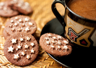 Closeup of chocolate cookies and a cup of coffee
