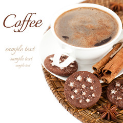 Сup of coffee, cookies, cinnamon and star anise