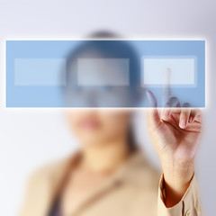 Businesswoman select a choice on virtual screen.