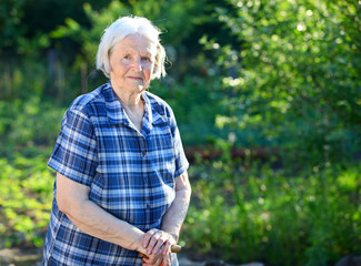 Portrait of an elderly woman outdoors