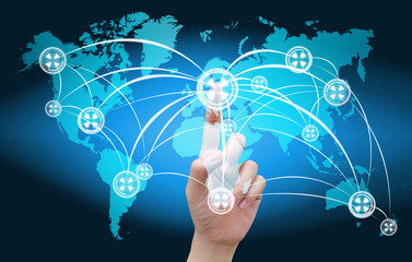 hand pushing social network on world map
