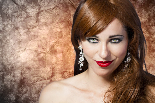 Picture of a beautiful woman with red hair wearing beautiful jew