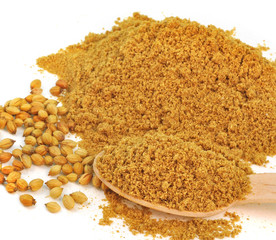 close up of powdered and whole coriander