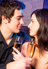 Couple with glasses of champagne on date
