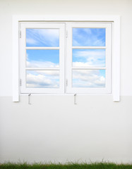 white window and wall with sky