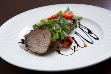 Beef medallions served with balsamic sauce