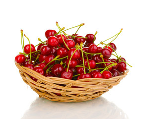 Ripe cherry berries in basket isolated on white