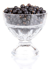 Black currant in glass isolated on white