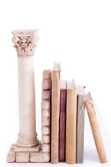 Roman column bookend and old books