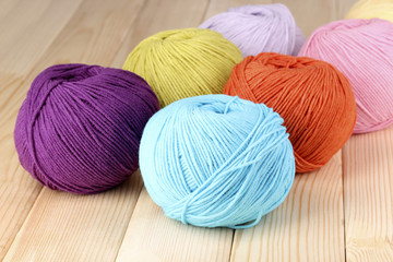 Knitting yarn on wooden background