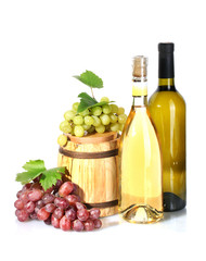 barrel and bottles of wine and ripe grapes isolated on white