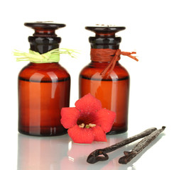 Vanilla pods with essential oil isolated on white