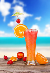 Summer cocktail with blur beach on background