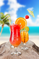 Summer cocktails with blur beach on background
