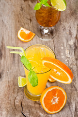 Orange cocktail on wood, top view