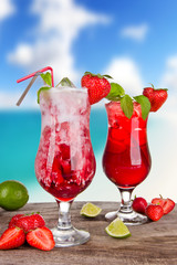 Strawberry cocktails with blur beach on background