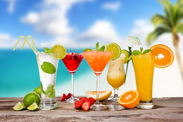 Summer cocktails with blur beach on background