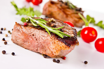 Beef steak medium grilled, isolated on white background