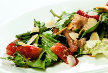Roasted Strawberries with lettuce leaves and nuts with a shallow