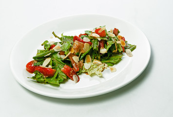 Roasted Strawberries with lettuce leaves and nuts