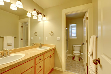 Fototapeta na wymiar Classic two sink bathroom in beige color.