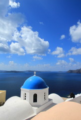 Fototapeta na wymiar Blue dome of a church, Oia, Santorini, Greece