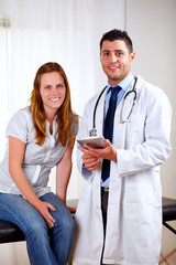 Handsome medical doctor with a young woman