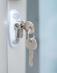 Door lock witj keys macro shot - Real estate concept