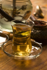 Cup of turkish tea and hookah served in traditional style