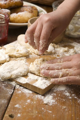 Detail of hands kneading dough