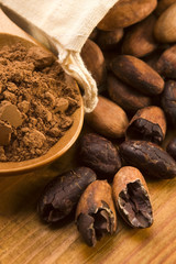 Cocoa (cacao) beans on natural wooden table