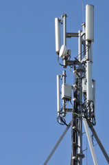 Cell Phone Tower against Blue Sky