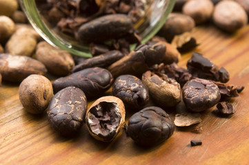 Cocoa (cacao) beans on natural wooden table
