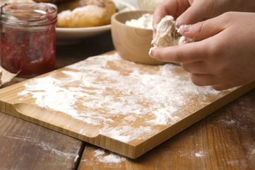Detail of hands kneading dough