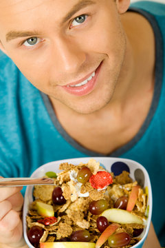 Man eating cerelas