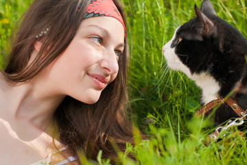 Young beautiful teenage girl and her cat portrait