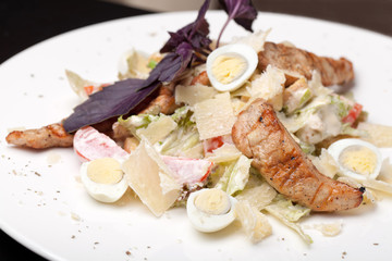 Caesar salad on white plate