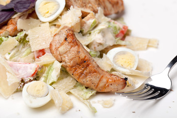 Caesar salad on white plate