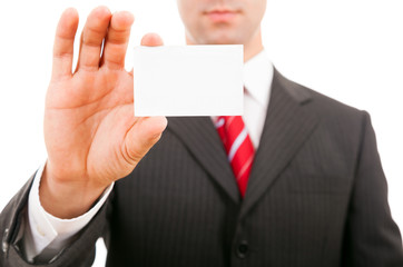 young business man holding blank business card, isolated on whit
