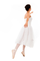 Fototapeta premium young beautiful ballerina posing in white background