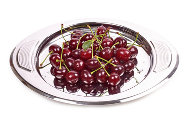 black cherries on a metal tray
