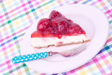 a slice of strawberry cheesecake