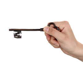 woman's hand holding an antique key on white background