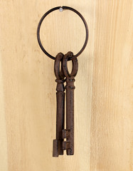 bunch of keys on wooden background
