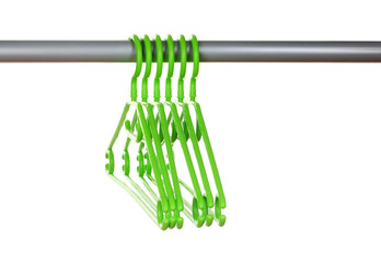 plastic hangers in row  isolated on white