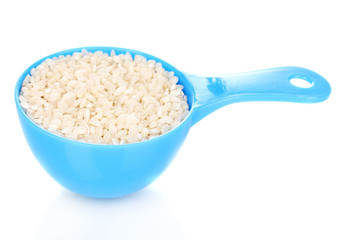 Measuring spoon with grain isolated on white