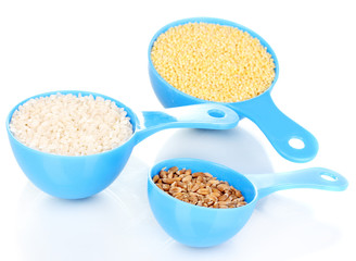 Measuring spoons with grain isolated on white