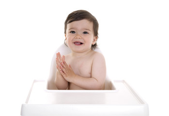 Baby excited in highchair