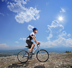 A young biker biking a mountain bike