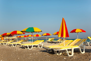 sun umbrella and chairs on a beach